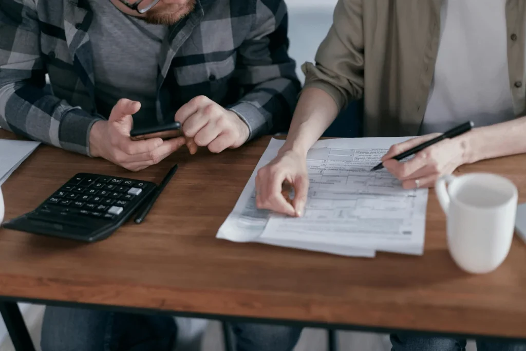 two people analyzing tax documents, symbolizing due-diligence
