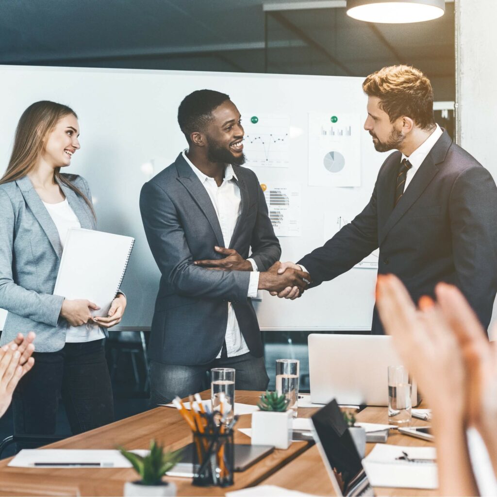 business team shaking hands symbolizing success and shared goals