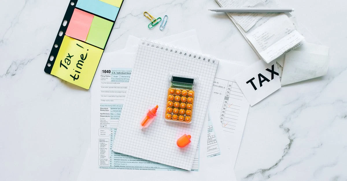 Tax documents, calculator, and sticky notes displaying new AMT rules Canada information on marble desk surface.
