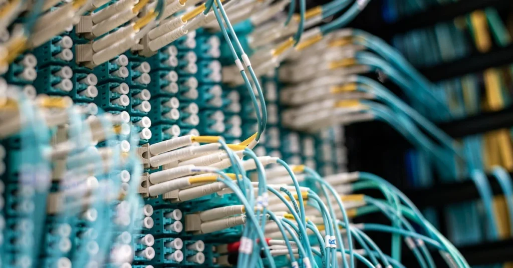Complex network of circuit board connectors and cables illustrating software industry M&A integration infrastructure.