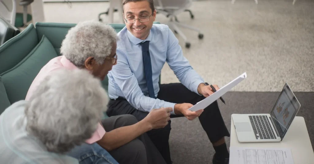 CPA consultant discussing alternative minimum tax Canada calculations with senior client in modern office setting.